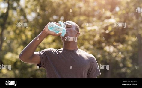 Black Man Drinking Water Suffering From Hot Weather Stock Photo Alamy