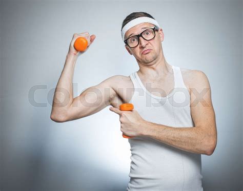 Funny Weak Man Lifting Biceps Stock Image Colourbox