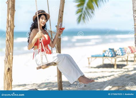 Asian Tourist Woman In Orange Bikini On The Beach Stock Image Image