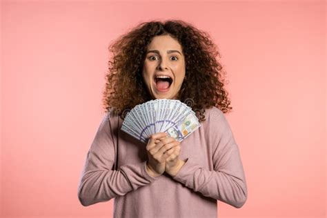 Happy Excited Girl In Pink Sweater Showing Money Us Currency Dollars