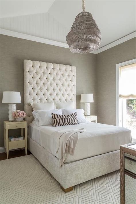 Cream And Gray Bedroom Features A Vaulted Ceiling Accented