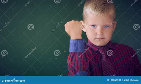 Closeup Portrait Of Angry Caucasian Boy Showing Fist Demanding Justice