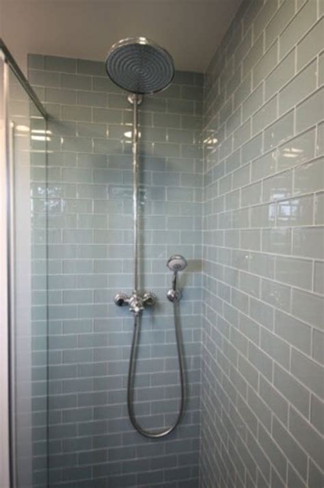 Go for mosaic glass tiles in a recurring border, or use a border of black tiles to divide a white and brown mosaic tile creation, breaking up the wall space. 35 blue gray bathroom tile ideas and pictures