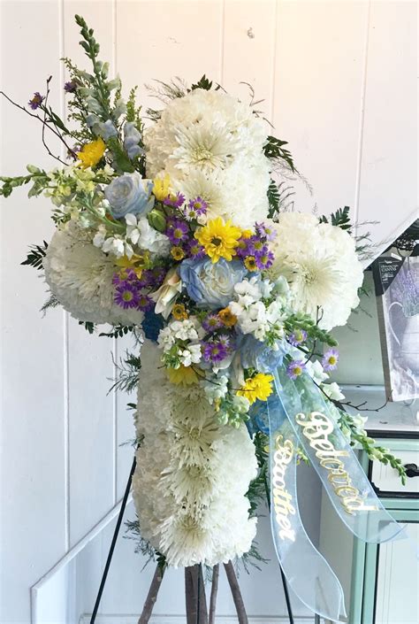 Maybe you would like to learn more about one of these? Sympathy Funeral Cross in Blue, Yellow and Purple by ...