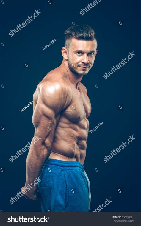 Strong Athletic Man On Black Background Stock Photo 355893821