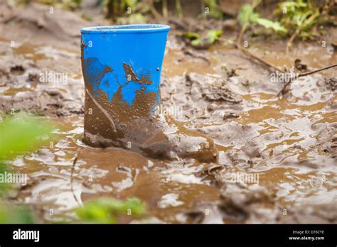 Children Gumboot Stuck In Mud Stock Photo Alamy