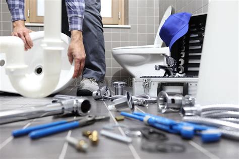 Plumber At Work In A Bathroom Plumbing Repair Service Assemble Stock Image Image Of Install
