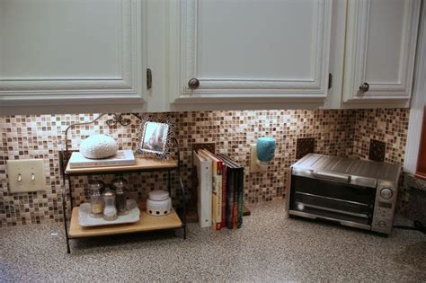 Installing ceramic tiles on a backsplash is hardly a novel idea. Kitchen Tile Backsplash {Do-It-Yourself