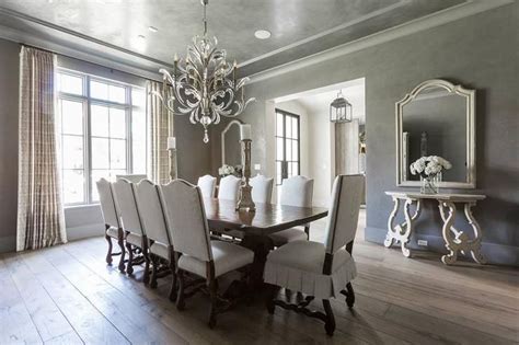 The chairs look squatty otherwise. White and gray dining room features a gray ceiling ...