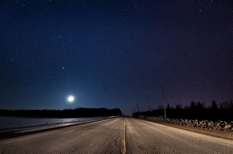 Road Beside The Body Of Water During Nighttime Hd Wallpaper Wallpaper