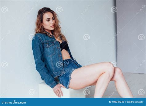 Portrait Of A Beautiful Fashionable Woman In A Denim Jacket And Shorts Stock Image Image Of