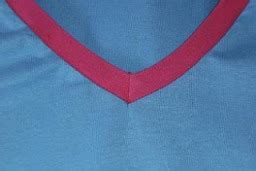 One of the easiest ways to finish a neckline is to just bind it using some bias strips. Tutorial: V-neck t-shirt binding - Sewing