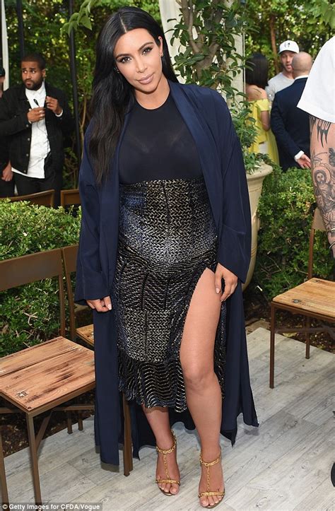 Kim Kardashian Flashes Some Leg In Sparkly Dress At Vogue Fashion Show Daily Mail Online