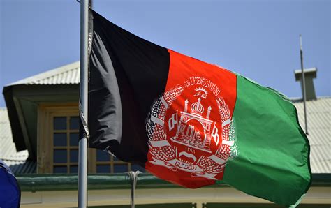 The Afghanistan Flag Is Shown Blowing In The Wind Over International