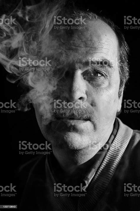 Portrait Of Man In Cigarette Smoke Stock Photo Download Image Now