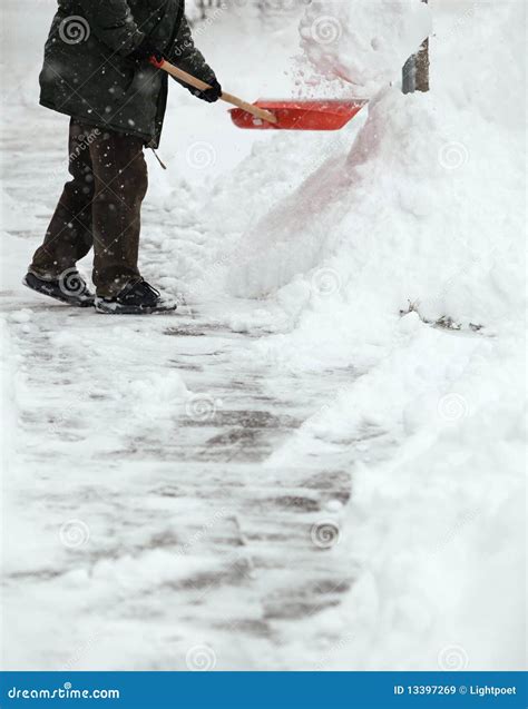 Man Shoveling Snow From The Sidewalk Royalty Free Stock Images Image