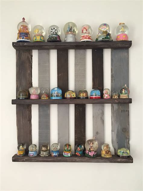 A Great Way To Display Snow Globes And Look Good All At The Same Time