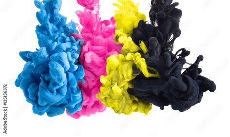 Color Splashes Of Ink In Cyan Magenta Yellow Black As Symbol For