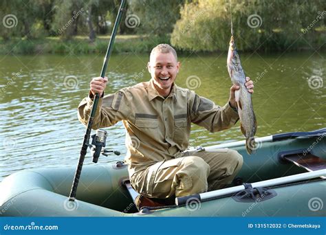 Man With Rod And Catch Fishing From Boat Stock Photo Image Of Angling