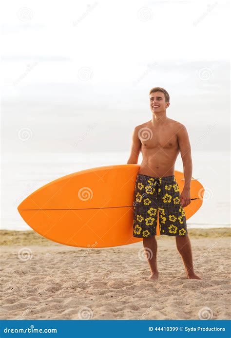 Smiling Young Man With Surfboard On Beach Stock Image Image Of
