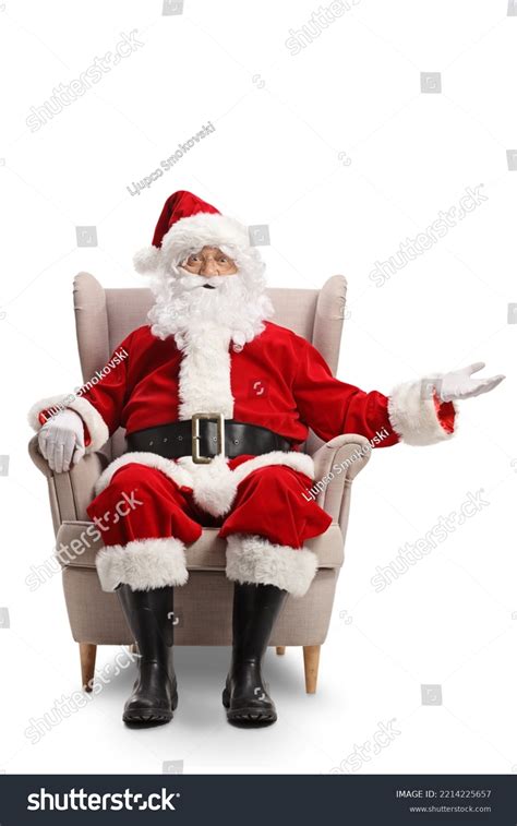 Santa Claus Sitting Armchair Showing Something Stock Photo 2214225657