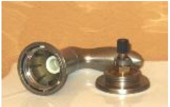 To remove the handle, carefully remove a small plug on the front of the handle, some have the moen name on them and the one that we currently have is the same color as the faucet. Replace the Valve in a Two Handle Faucet - KOHLER