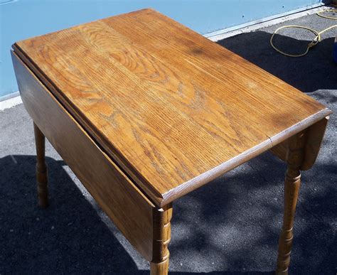 Great work or dining surface with extra space available with the leaves up, plus a large open area, shelving perfect for holding four. The Pastel Prairie: Antique Oak Drop Leaf Table