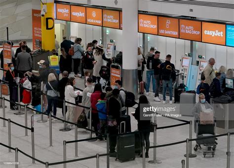 Passengers Check In At The South Terminal Of Gatwick Airport In West