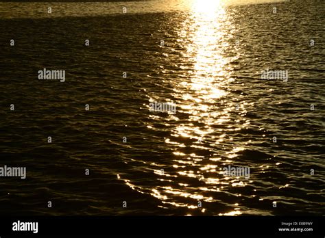 Sunlight Reflection On The Water Stock Photo Alamy