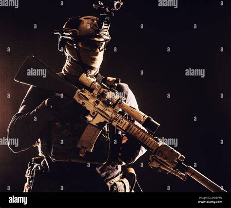 Army Marksman With Sniper Rifle In Darkness Stock Photo Alamy