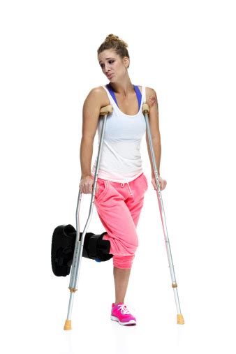 Woman With A Leg Brace And Crutches Stock Photo Download Image Now