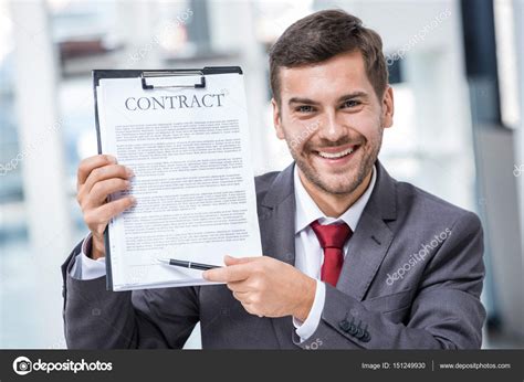 Businessman Holding Contract — Stock Photo © Dmitrypoch 151249930