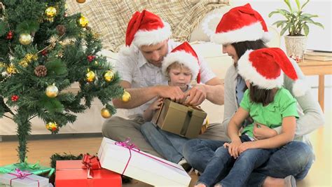 She thought it looked so expensive and rich. Family Opening Christmas Gifts At Home. Footage In High ...