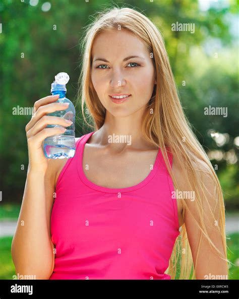 Young Woman Drinking Water After Fitness Exercise Stock Photo Alamy