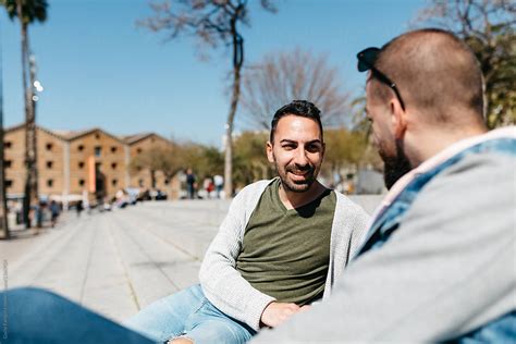 Gays Talking On Steps On Sunny Day By Stocksy Contributor Guille Faingold Stocksy