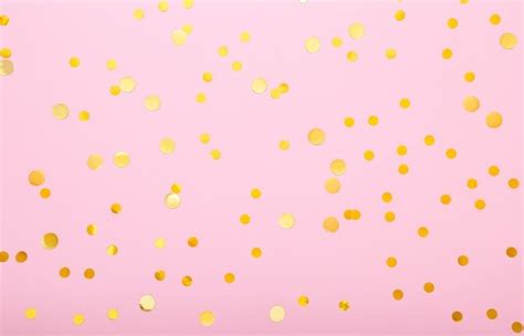 Premium Photo Shiny Confetti On A Pink Background