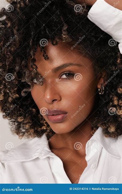 Attractive African American Young Woman Smiling With Curly Black Hair
