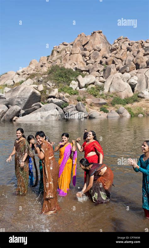 Indian Women Bathing In The Tungabhadra River Hampi Karnataka India
