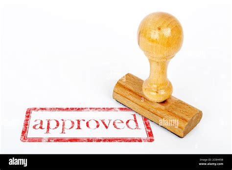 Office Rubber Stamp With Approved Stamp On White Paper Stock Photo Alamy