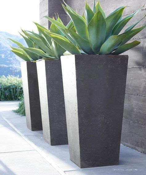 Treat your plants with a new ceramic pot, metallic planter or maybe a lightweight grow bag! tall grey modern planters | Modern backyard landscaping ...