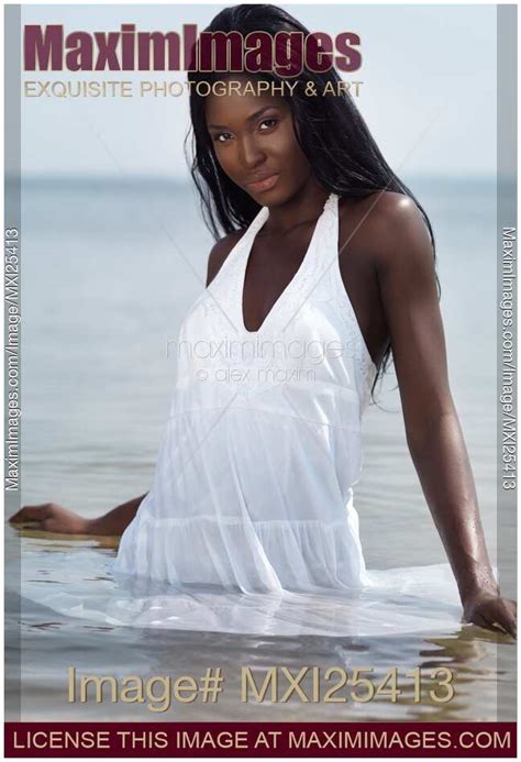 Photo Of Beautiful Black Woman In Dress Standing In Water Stock Image