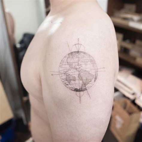 Single Needle Planet Earth Tattoo On The Left Shoulder