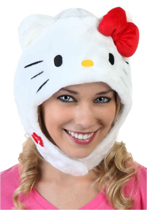 a woman wearing a hello kitty hat and smiling