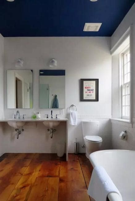 The ceiling is white and the walls are actually a very light shade of grey, giving the bathroom a less austere appearance than white walls would have. Dark Ceiling Designs in Modern Kitchens and Bathroom Interiors