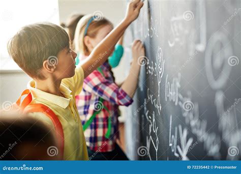 Writing On Blackboard Stock Photo Image Of Young Schoolchildren