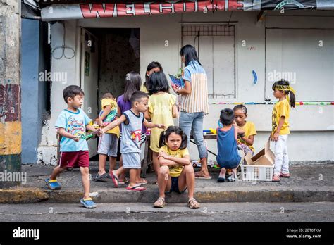 Young Filipino Children Play In The Street In The Old Walled City Of