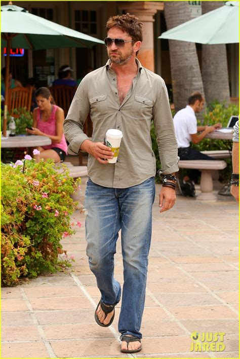 gerard butler scopes out surf gear after kissing session with mystery girl photo 3169587