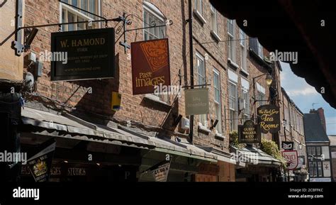 Shop Signs In The Shambles An Old Street In The City Of York