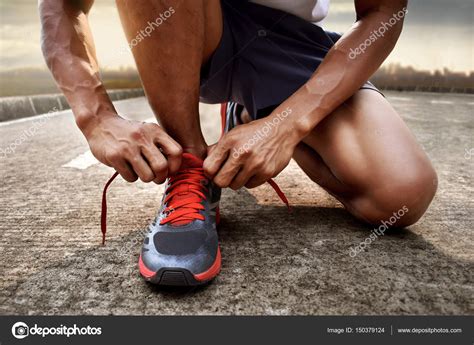 Man Tying Running Shoes — Stock Photo © Fotokitas 150379124
