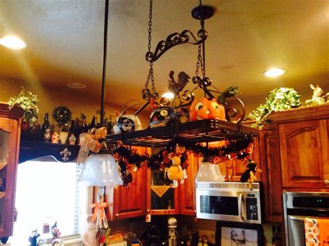 Take your cookware to new heights. Pot rack | Pot rack, Ceiling lights, Decor